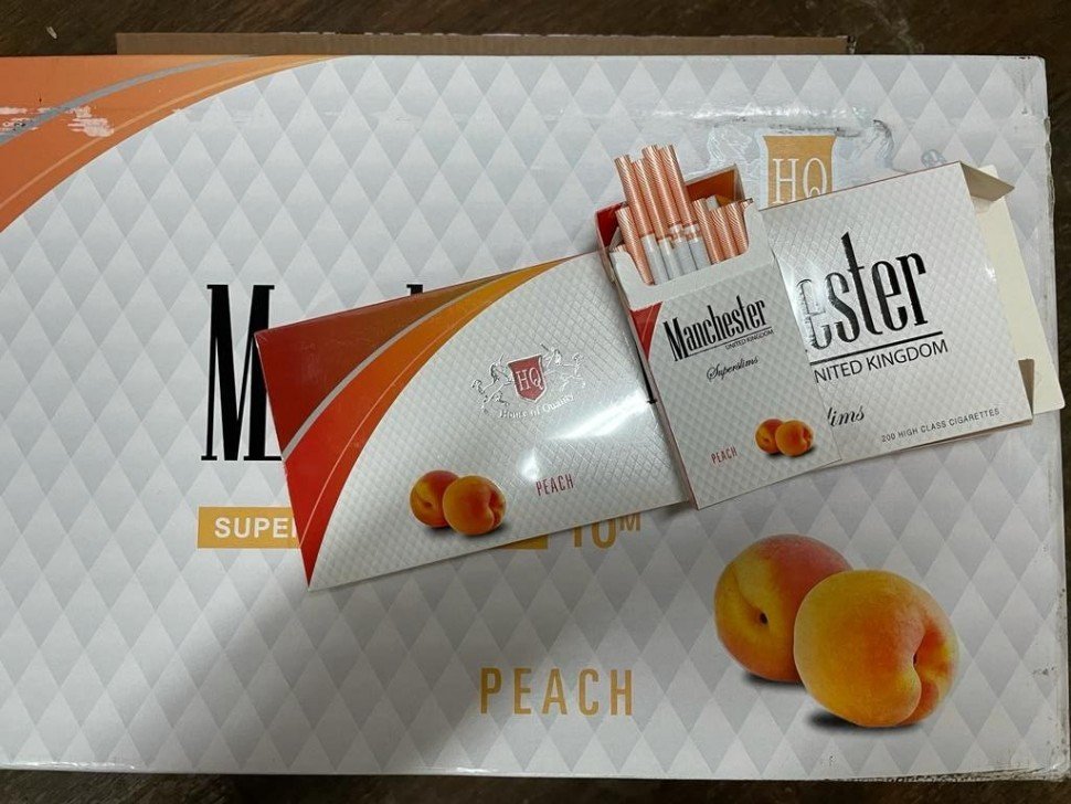 Сигареты Manchester Peach Superslims оптом Сигареты Manchester Peach Superslims оптом