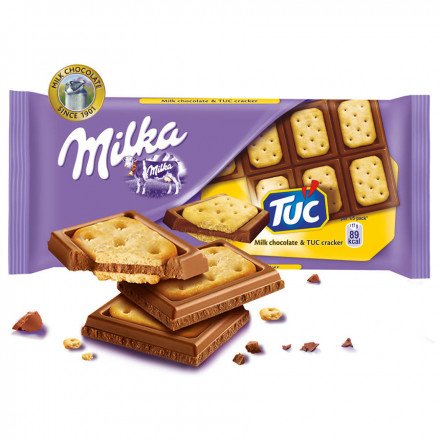 Milka шоколад молочный с соленым крекером Tuc, 87 г оптом 
